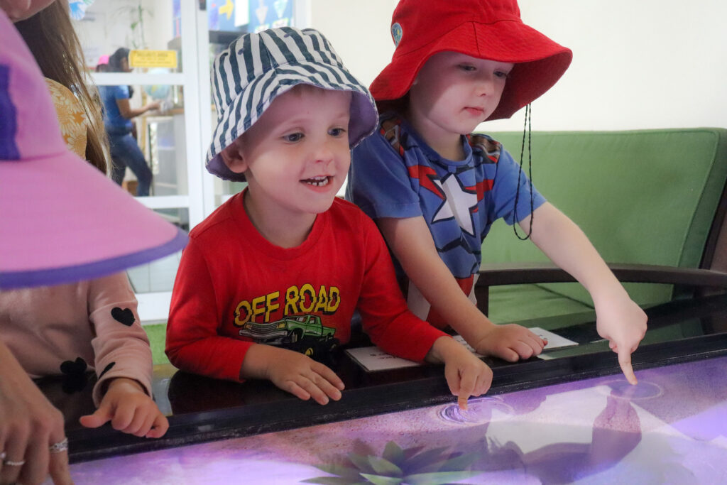 child following morning routine at Centenary Childcare Centre