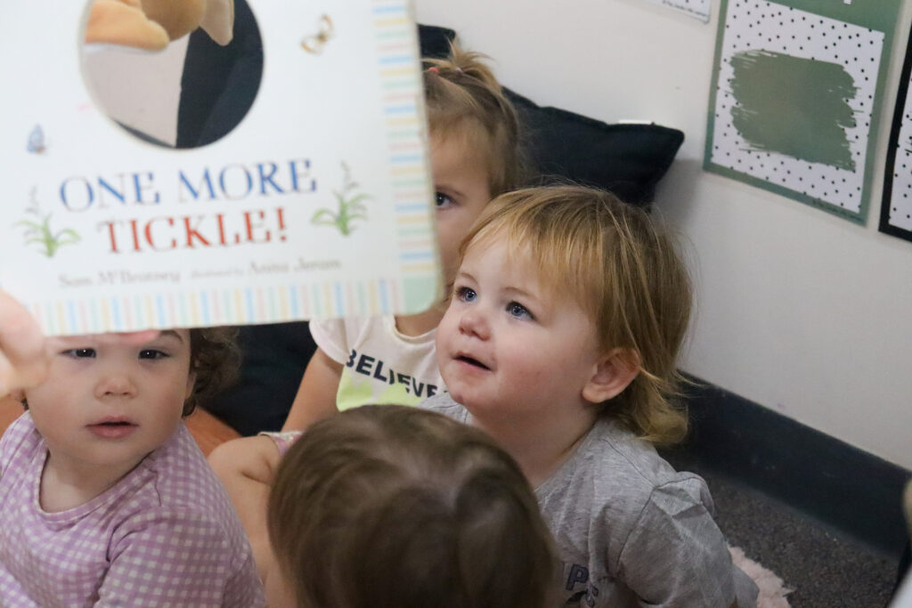 Parent reading to a child to support early literacy and brain growth