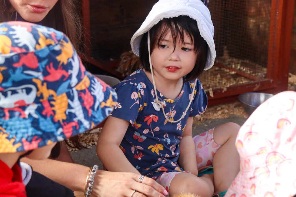 Toddler speaking openly while playing at Centenary Childcare Centre in Mount Ommaney